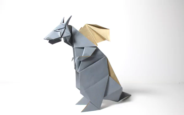 Man-made origami dragon with gold wings on a white background — 5K Ultra HD PC desktop wallpaper and background.