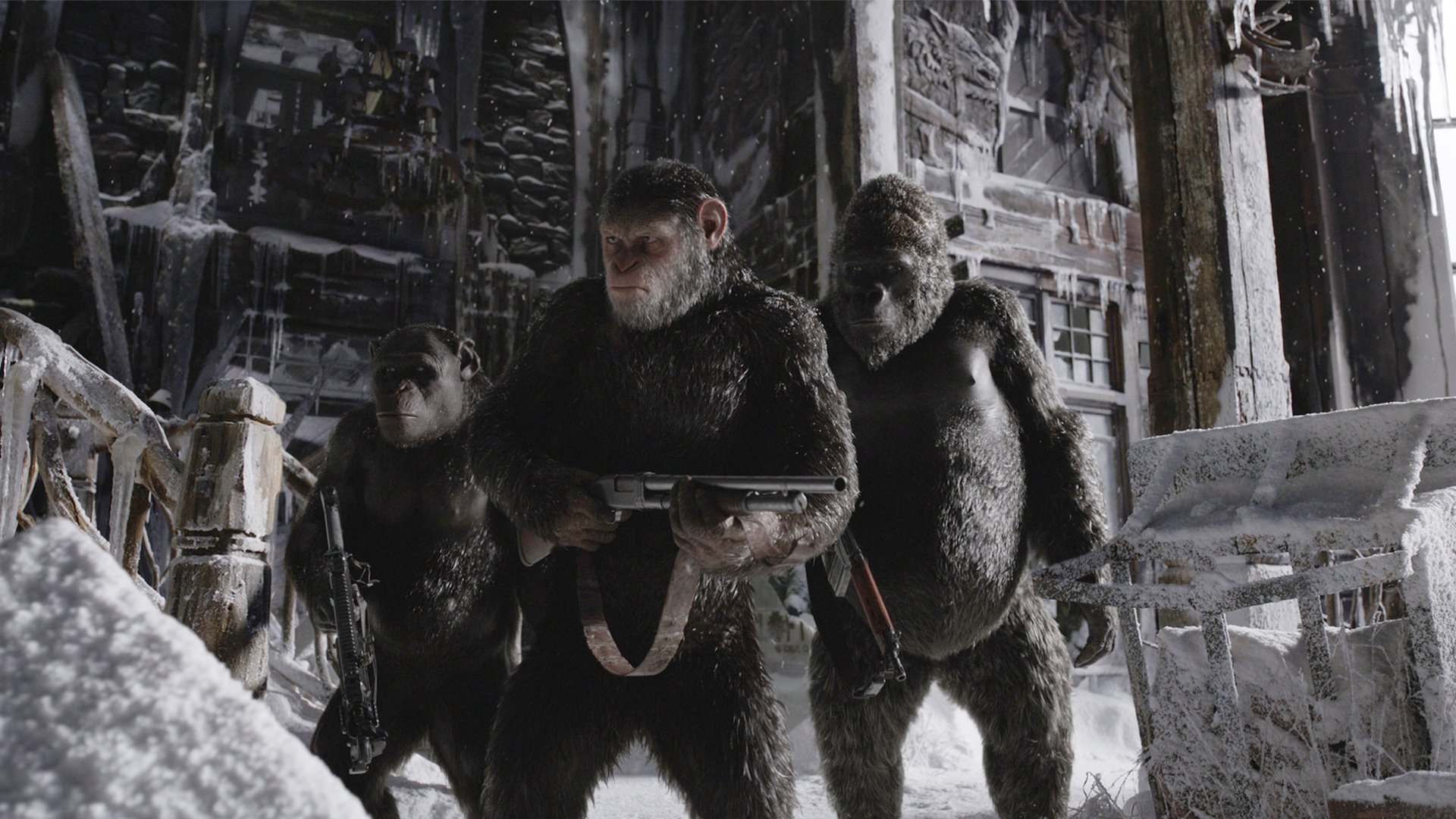 HD desktop wallpaper featuring apes from the movie War For The Planet Of The Apes, standing in a snowy, post-apocalyptic setting, holding weapons and preparing for action.