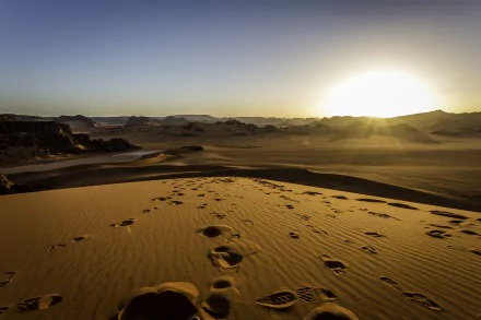 Sunset over vast sand dunes of the Sahara Desert in Tassili N'Ajjer, Algeria, showcasing the natural beauty of Africa's desert landscape in 4K Ultra HD.