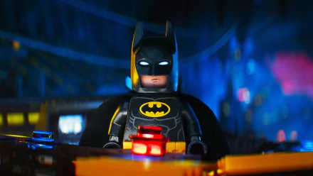 HD desktop wallpaper featuring Lego Batman from The Lego Batman Movie, showcasing him in a dark, vibrant setting with glowing eyes and a dramatic expression.