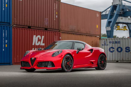 Red Alfa Romeo 4C supercar parked in front of stacked shipping containers, captured in 4K Ultra HD for a striking PC desktop wallpaper background.