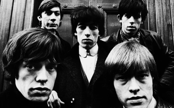 Black and white HD PC desktop wallpaper featuring The Rolling Stones in a classic group portrait from a TV show appearance.
