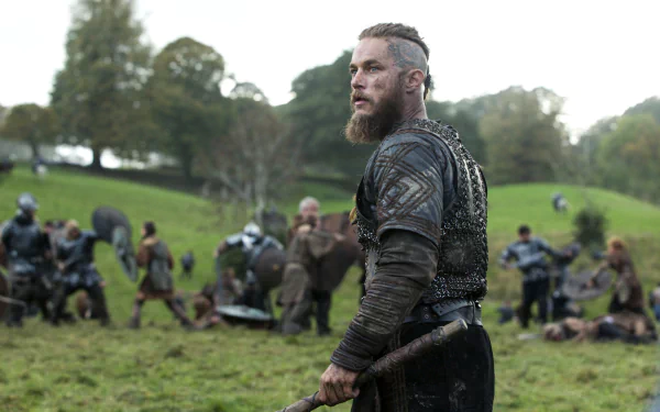 4K Ultra HD desktop wallpaper featuring a scene from the TV show Vikings (2013) with a warrior in armor holding an axe on a grassy battlefield.