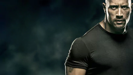 HD desktop wallpaper: close-up of a stern, muscular man in a black shirt against a smoky background, styled like a poster still from the movie Faster.