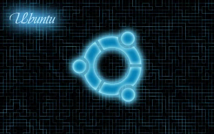 A striking HD desktop wallpaper featuring the Ubuntu logo in glowing blue against a dark, tech-inspired background, celebrating the Linux operating system.