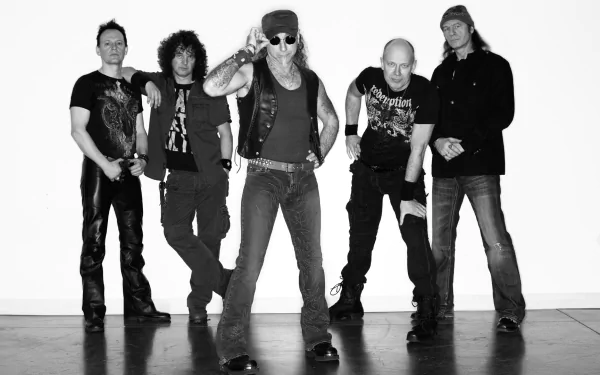 Black-and-white HD PC desktop wallpaper of a heavy metal music band: five members in leather and denim pose confidently against a plain white backdrop.