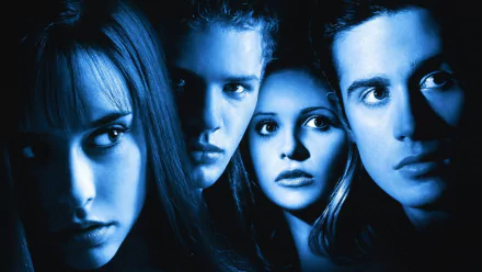 Blue-tinted HD PC desktop wallpaper and background featuring four tense young faces in close-up, poster-style for the movie I Know What You Did Last Summer.