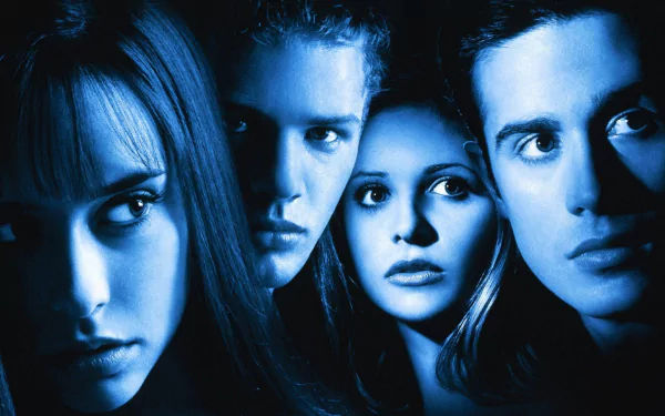 Blue-tinted HD PC desktop wallpaper and background featuring four tense young faces in close-up, poster-style for the movie I Know What You Did Last Summer.
