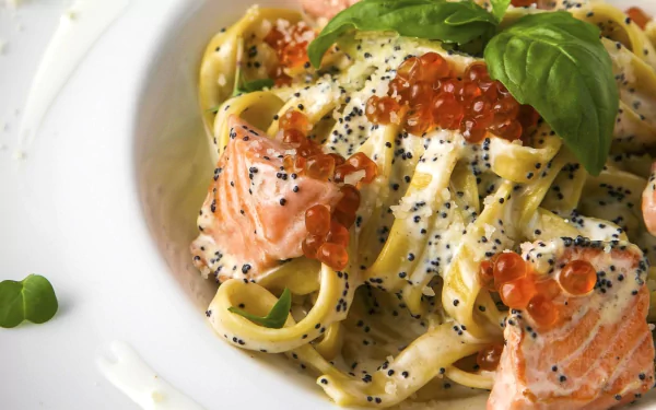 Close-up of a creamy pasta dish with salmon, salmon roe, basil, and black sesame seeds, presented as an HD PC desktop wallpaper and background.