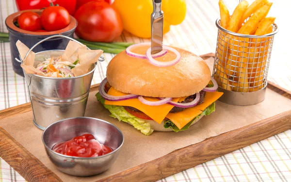 HD still life of a cheeseburger with lettuce and onion, served with golden french fries and ketchup, presented as a vibrant PC desktop wallpaper background.