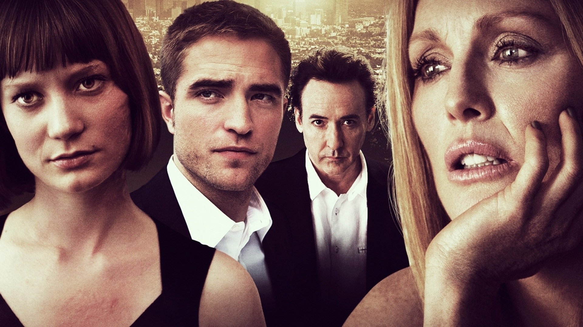 HD desktop wallpaper of the movie Maps to the Stars featuring Robert Pattinson, Mia Wasikowska, John Cusack, and Julianne Moore against a cityscape background.