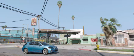 HD PC desktop wallpaper featuring a street scene from the video game Grand Theft Auto V, showcasing a clear sky, palm trees, and urban details.