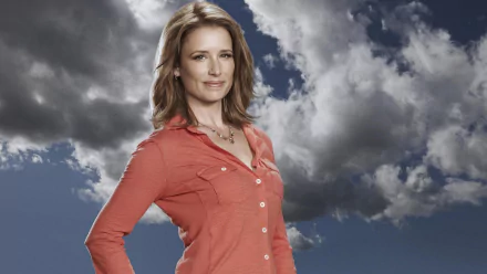HD desktop wallpaper of a confident woman in a red blouse posed against a dramatic cloudy sky; promotional TV-show style image referencing Anger Management.
