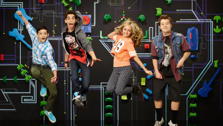 Four young people leaping in front of a neon circuit-board backdrop inspired by the TV show Gamer’s Guide to Pretty Much Everything — HD PC desktop wallpaper.