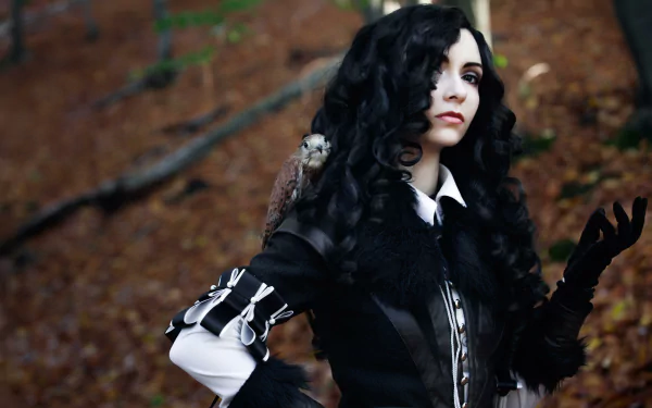 A stunning HD desktop wallpaper featuring a woman's cosplay of Yennefer of Vengerberg from The Witcher 3: Wild Hunt, showcasing her as a brunette against a forest background.