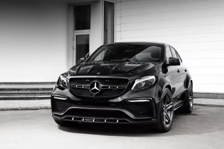 Black Mercedes-Benz GL-Class SUV parked before a white wall, luxury black car in a high-contrast 4K Ultra HD PC desktop wallpaper and background.