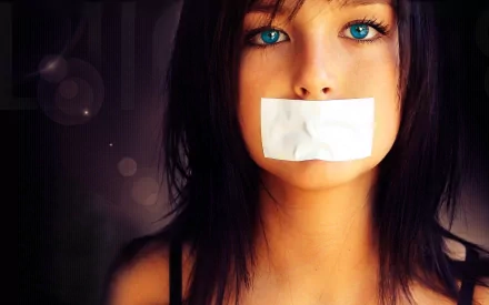 HD PC desktop wallpaper featuring a mysterious woman with striking blue eyes and tape over her mouth against a dark, blurred background.