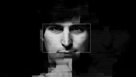HD desktop wallpaper featuring a stylized black-and-white portrait of Steve Jobs from the movie Steve Jobs: The Man in the Machine, highlighting his visionary gaze.