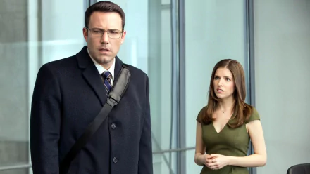 HD wallpaper featuring Anna Kendrick and Ben Affleck in a scene from the movie The Accountant, standing in a modern glass-walled building.