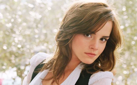 HD desktop wallpaper featuring celebrity Emma Watson with a serene, nature-filled background.