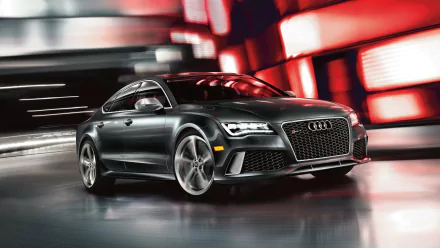 HD desktop wallpaper featuring a sleek silver Audi RS7 car in a dynamic urban setting with blurred red and white lights.