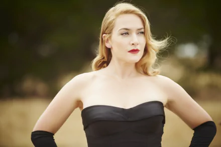 Kate Winslet in a scene from the movie The Dressmaker, featured in a 4K Ultra HD PC desktop wallpaper with a blurred natural background.
