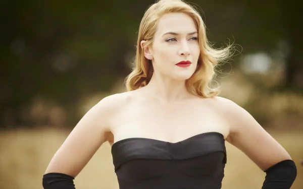 Kate Winslet in a scene from the movie The Dressmaker, featured in a 4K Ultra HD PC desktop wallpaper with a blurred natural background.