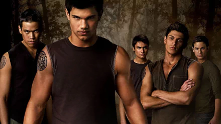 A striking HD wallpaper from The Twilight Saga: New Moon, featuring Jacob Black surrounded by fellow characters, capturing a tense and dynamic moment in the film.