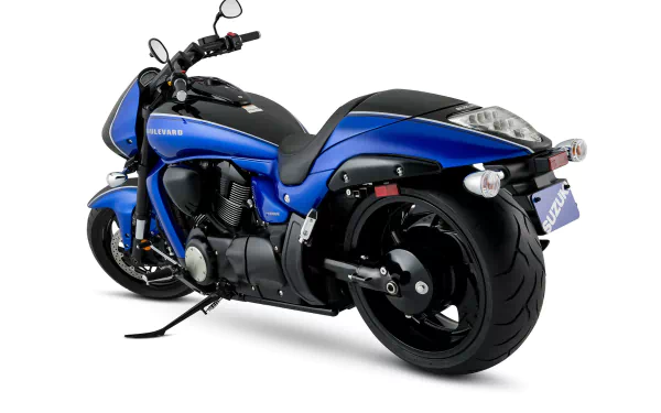 Vehicle - blue Suzuki Boulevard M109R BOSS cruiser motorcycle, rear three-quarter view on white backdrop, presented as an HD PC desktop wallpaper and background.