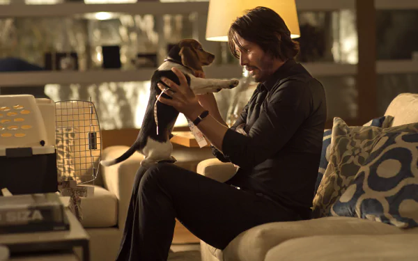 Keanu Reeves as John Wick gently holds a small dog in a warm, dimly lit living room, captured in a 4K Ultra HD movie wallpaper scene.
