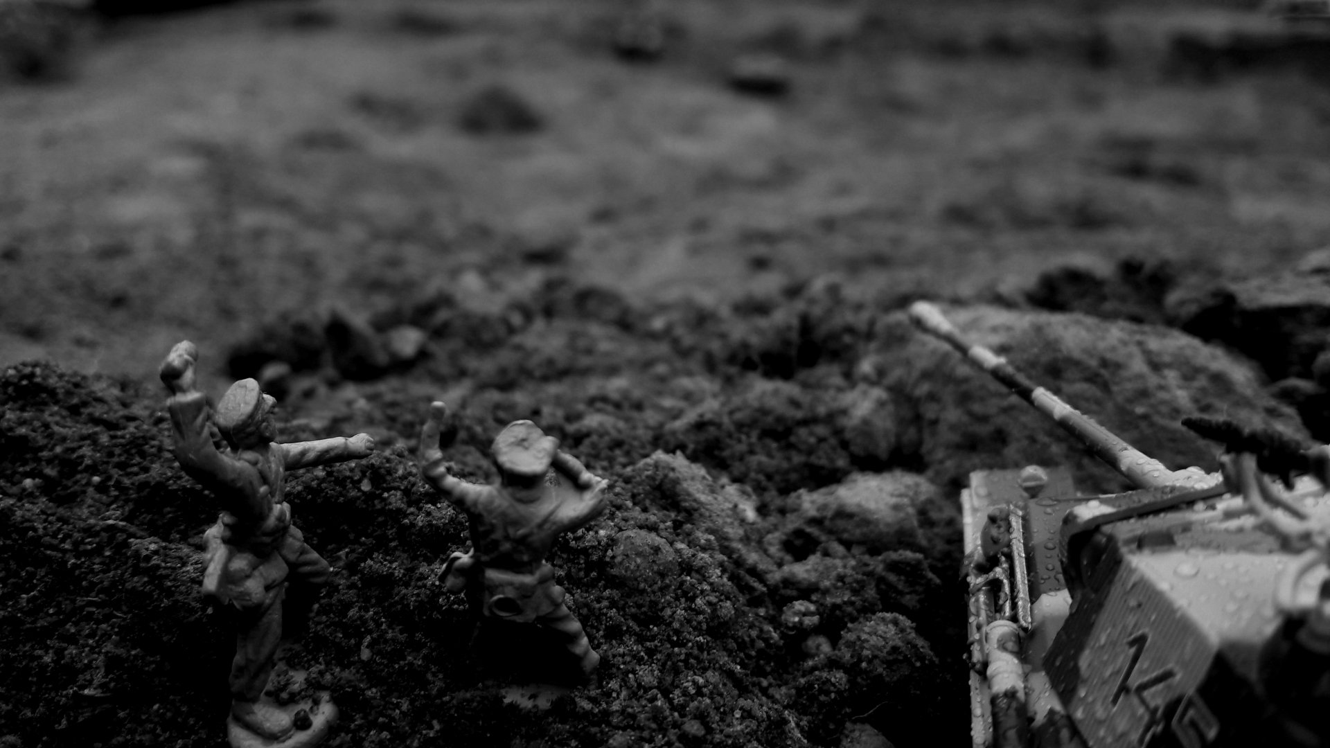 Black and white 4K Ultra HD image of a man-made toy tank and soldiers positioned in a war-like scene, captured as a detailed PC desktop wallpaper background.