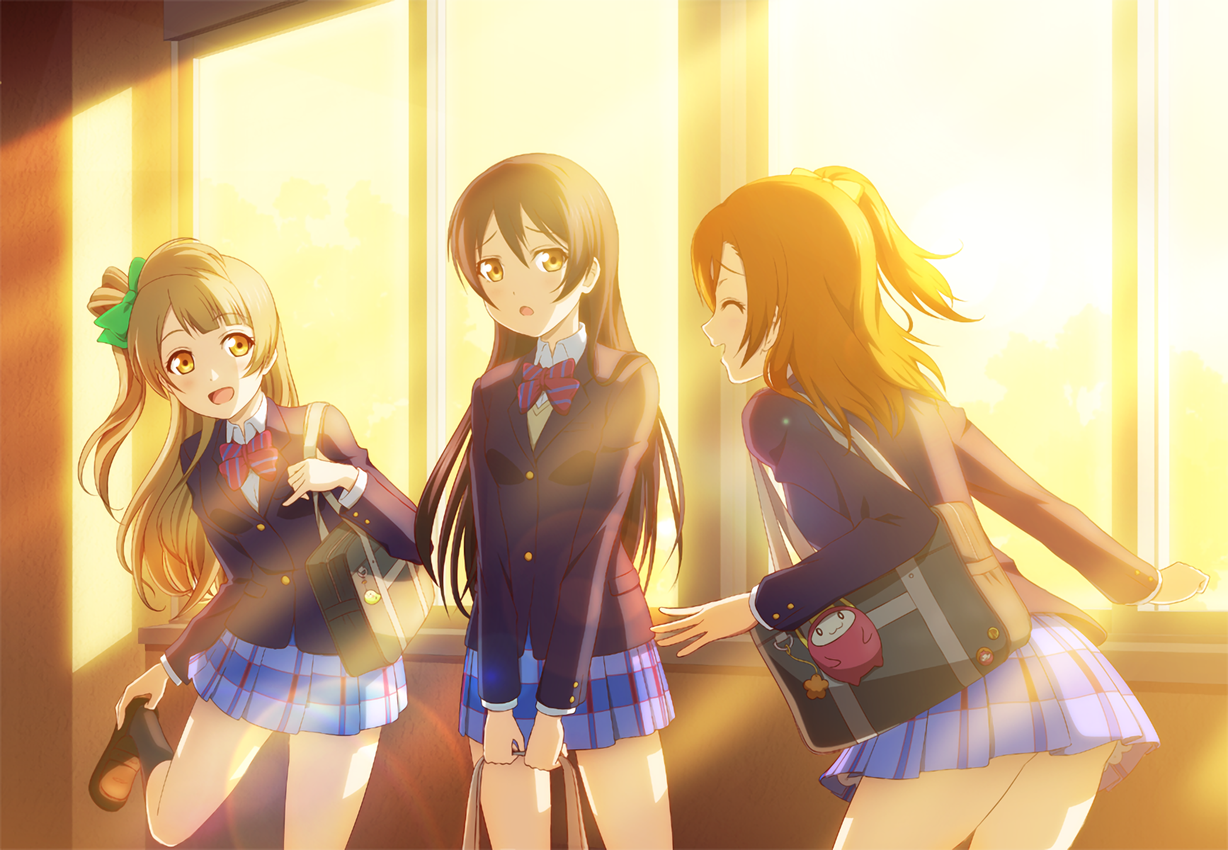 HD anime wallpaper featuring Honoka Kousaka, Kotori Minami, and Umi Sonoda from Love Live! in school uniforms bathed in warm, golden sunlight.