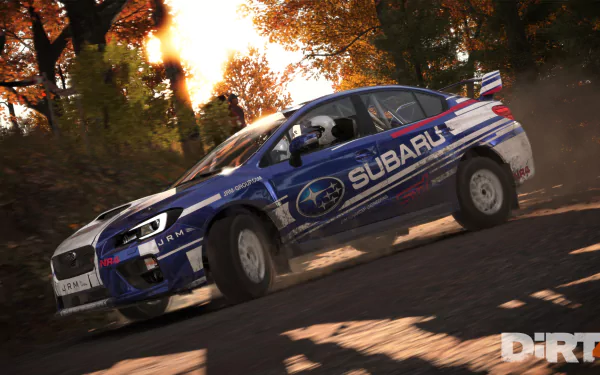 HD desktop wallpaper from Dirt 4 featuring a Subaru rally car speeding through an autumn forest.