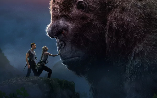 HD desktop wallpaper featuring Tom Hiddleston and Brie Larson in a scene with King Kong from the movie Kong: Skull Island, showcasing a dramatic and intense moment.