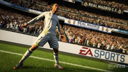 A high-definition desktop wallpaper featuring a player celebrating a goal in FIFA 18, with a packed stadium and Real Madrid C.F. banners in the background.