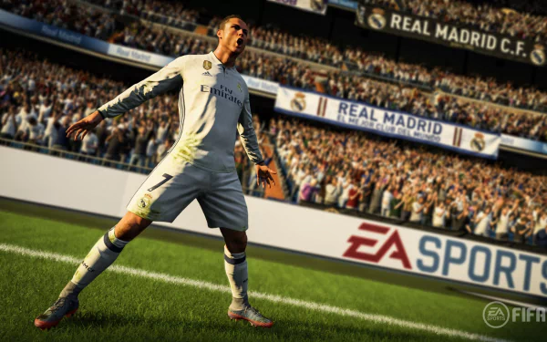 A high-definition desktop wallpaper featuring a player celebrating a goal in FIFA 18, with a packed stadium and Real Madrid C.F. banners in the background.