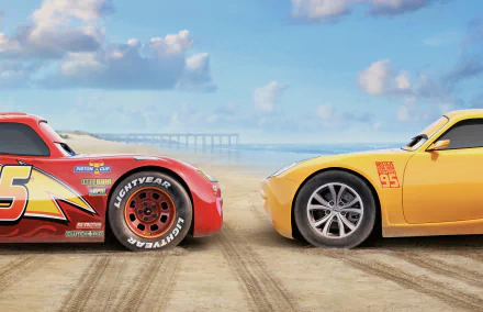 HD wallpaper featuring Cruz Ramirez and Lightning McQueen from the movie Cars 3, set against a beach backdrop with a clear blue sky and distant pier.