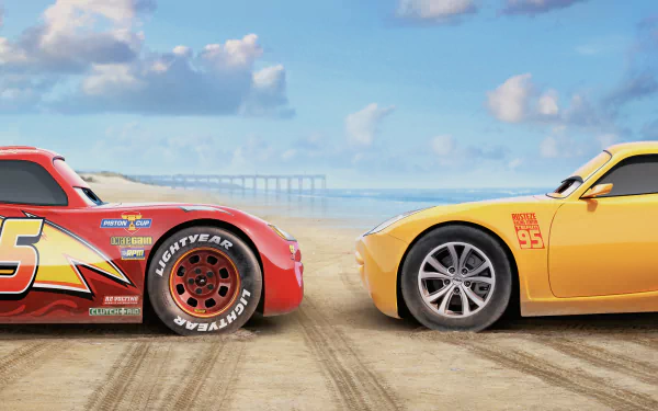HD wallpaper featuring Cruz Ramirez and Lightning McQueen from the movie Cars 3, set against a beach backdrop with a clear blue sky and distant pier.