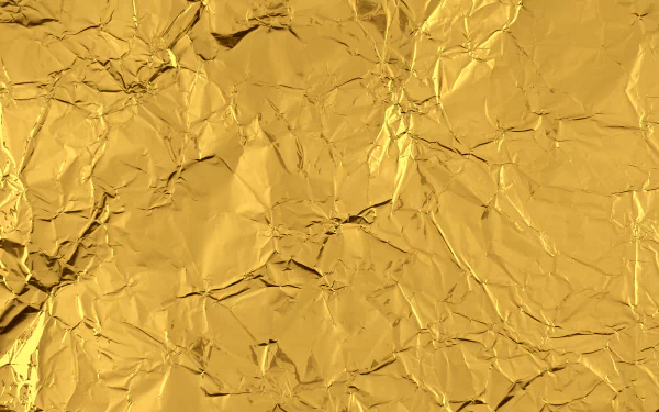 Gold abstract crumpled foil texture in high-resolution 4K Ultra HD, PC desktop wallpaper/background.