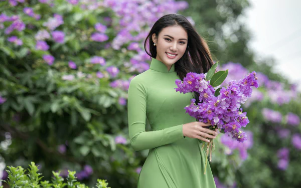brown eyes brunette smile depth of field purple flower flower green dress model woman asian HD Desktop Wallpaper | Background Image