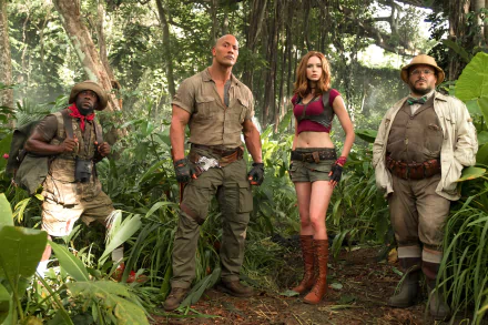 HD desktop wallpaper of Jack Black, Kevin Hart, Karen Gillan, and Dwayne Johnson in a jungle scene from the movie Jumanji: Welcome to the Jungle.