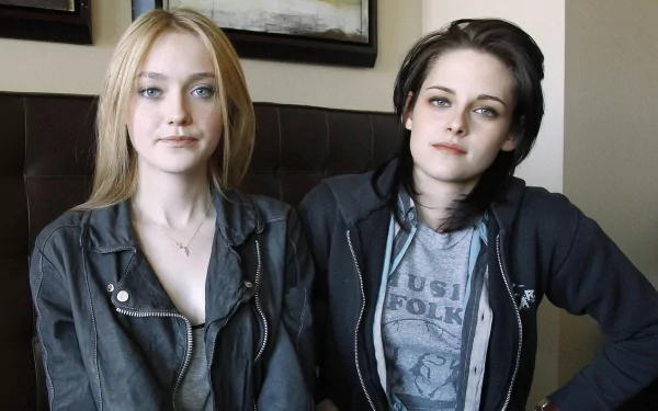 Dakota Fanning and Kristen Stewart pose together in a candid moment, showcasing their distinct styles as celebrated actresses in this HD desktop wallpaper.