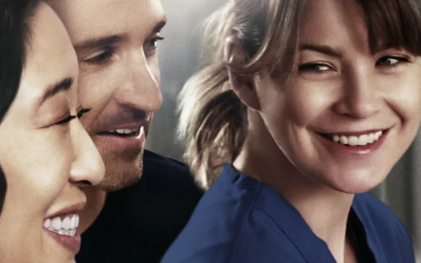 HD PC desktop wallpaper: close-up of three smiling hospital staff in scrubs from the TV show Grey's Anatomy.