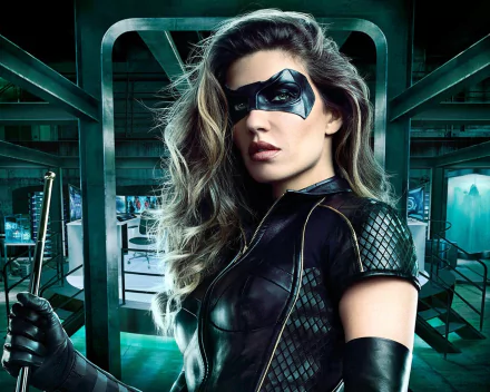 HD desktop wallpaper featuring Dinah Drake as Black Canary, portrayed by Juliana Harkavy in the TV show Arrow. She is in costume, holding a baton, set against a high-tech background.