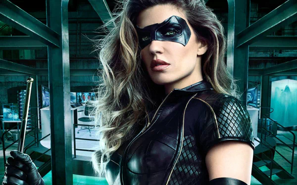 HD desktop wallpaper featuring Dinah Drake as Black Canary, portrayed by Juliana Harkavy in the TV show Arrow. She is in costume, holding a baton, set against a high-tech background.