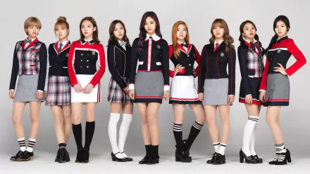 HD desktop wallpaper featuring the music group TWICE. The members are standing in a row, dressed in coordinated outfits with a school uniform theme. Bright and stylish background for music fans.