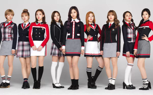 HD desktop wallpaper featuring the music group TWICE. The members are standing in a row, dressed in coordinated outfits with a school uniform theme. Bright and stylish background for music fans.