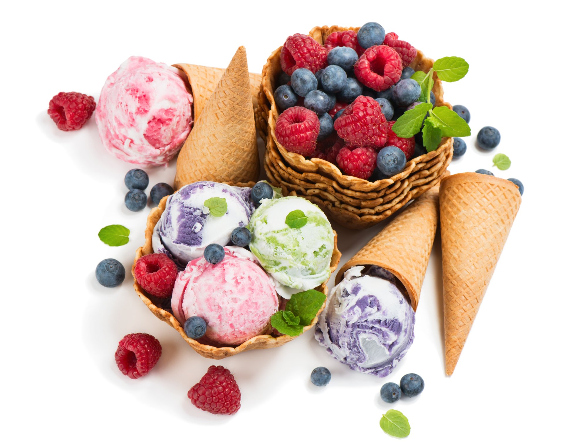 A vibrant 4K Ultra HD wallpaper featuring colorful scoops of berry-flavored ice cream in waffle cones alongside fresh blueberries and raspberries.