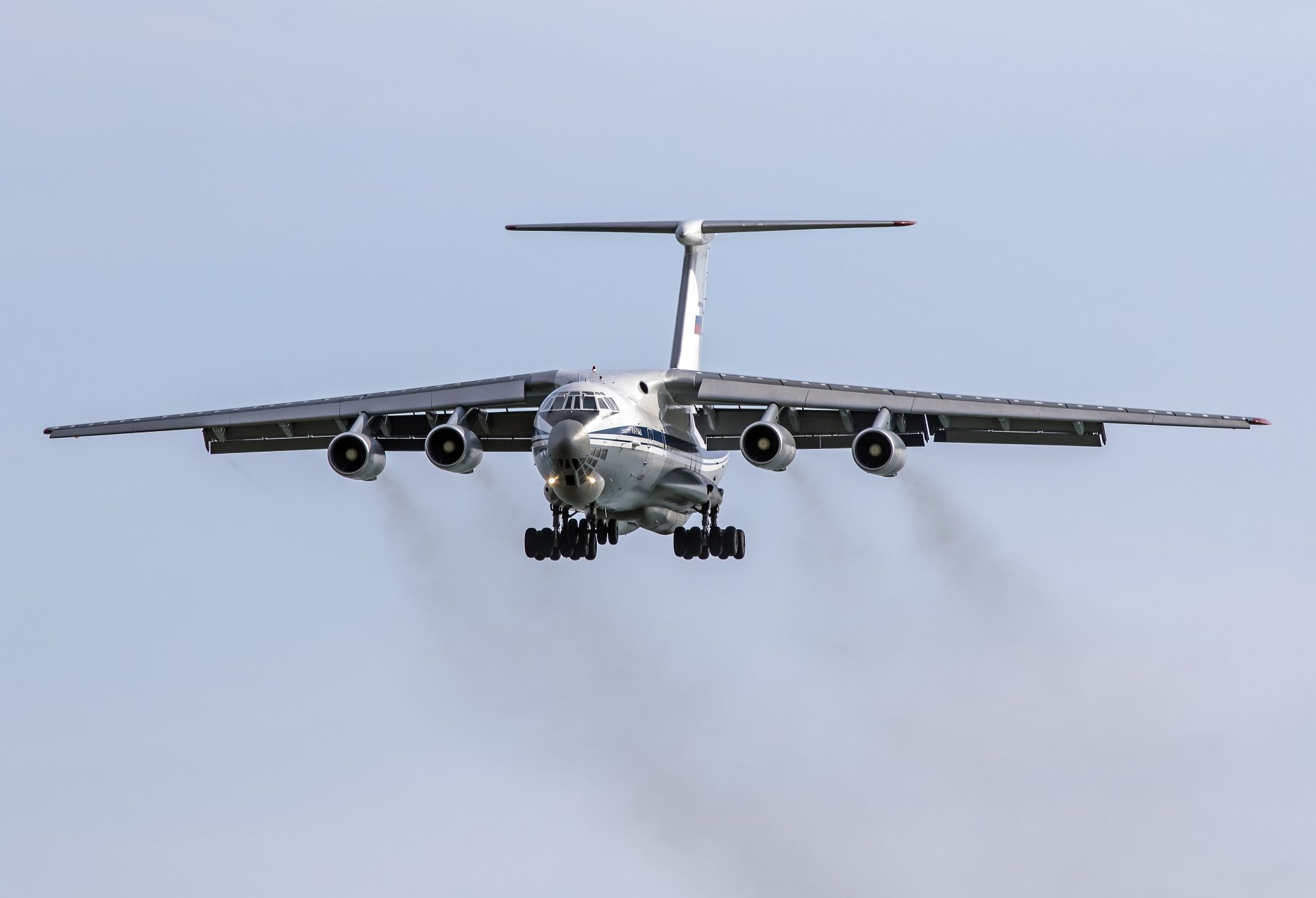 Front view of a military Ilyushin Il-76 transport aircraft in flight against a clear sky, showcased as a sharp 4K Ultra HD desktop wallpaper background.
