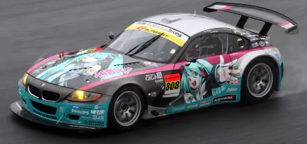 HD racing wallpaper featuring a BMW Z4 GT3 race car with vibrant Hatsune Miku-themed livery speeding on the track.
